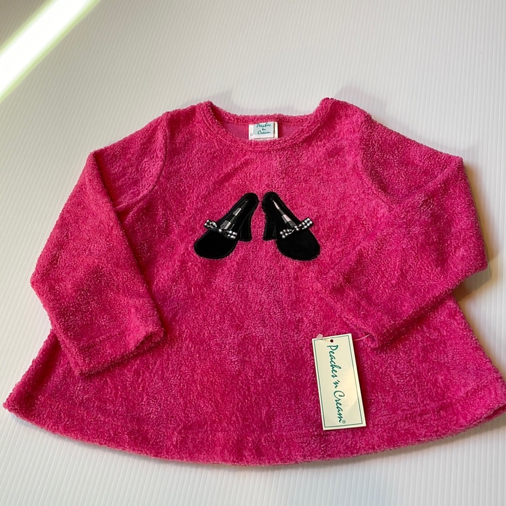 Peaches n Cream long sleeve pink fuzzy top with black heel details. Size 4T